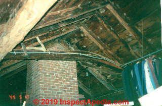 Antique hand hewn rafters and cross-collar tie in a pre-1900 home (C) Daniel Friedman at InspectApedia.com