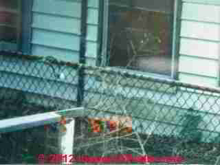 Buckled siding at ground level indicates sill crushing (C) Daniel Friedman