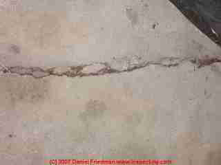 Photograph of a cracked concrete slab from frost damage