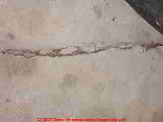 Photograph of a settlement crack in a garage floor