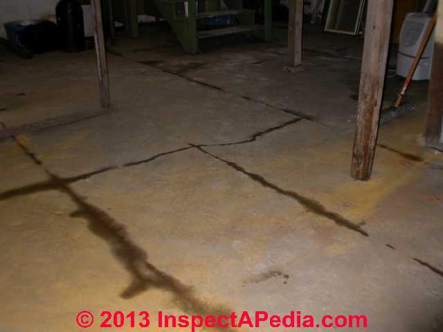 Concrete slab cracks heaves form trip hazards © Daniel Friedman at InspectApedia.com