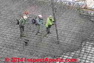 Using portable vibrators in concrete during a large concrete slab placement, Vassar College, Poughkeepsie NY 2013 (C) Daniel Friedman