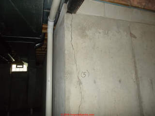 Vertical foundatin crack, leaning wall (C) Inspectapedia.com Janice