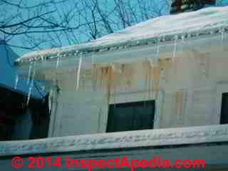 Ice forms at water exiting from vinyl siding due to roof ice dam leaks from above (C) Daniel Friedman