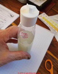 Step 6 in the arsenic level in water test - the special cap has been installed on the reaction bottle - in the open position (C) Daniel Friedman at InspectApedia.com