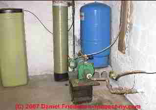 Indoor water tank and jet pump (C) InspectApedia.com