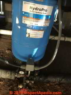 Leak at water pressure tank traced to shutoff (C) InspectApedia.com