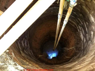 Silt removal needed in hand dug well (C) InspectApedia.com Oceansnotion