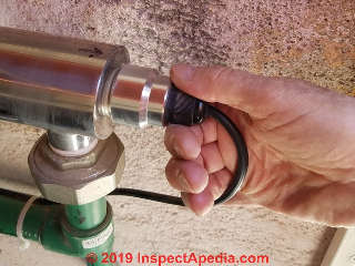 UV water purifier bulb connector inspection (C) Daniel Friedman at InspectApedia.com