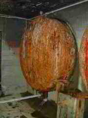 Photograph of huge water tanks at an old property with a well having a slow recovery rate.