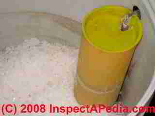 Photo of water softener interior showing salt