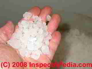 Closeup photo of water softener salt in the hand