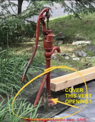 Hand pump (pitcher pump) on well with vent pipe needing cover (C) InspectApedia.com Dave